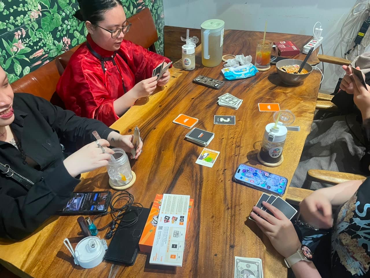 Group laughing over a bad draw in Trash Traders