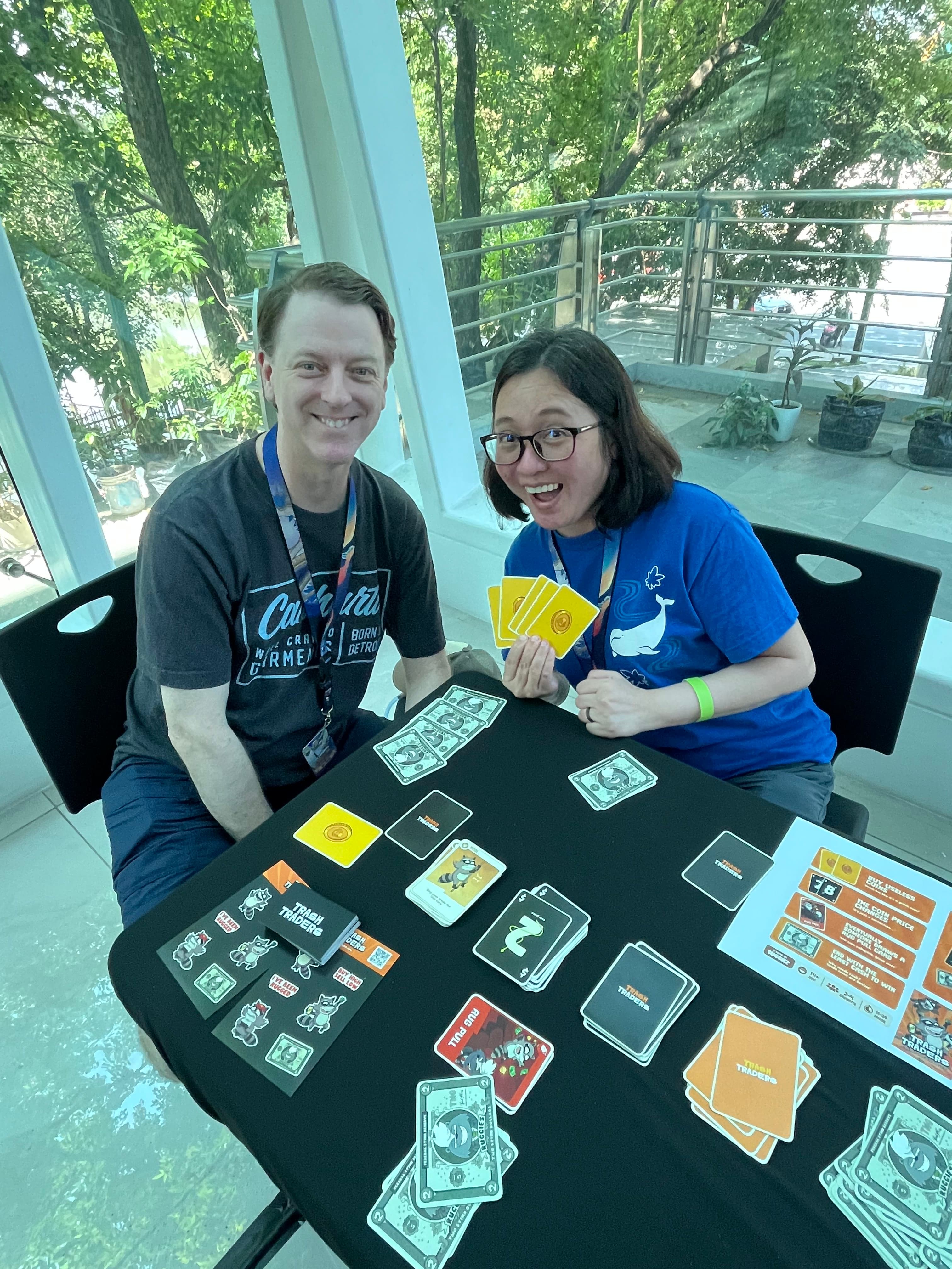 Players at a Trash Traders party card game demo