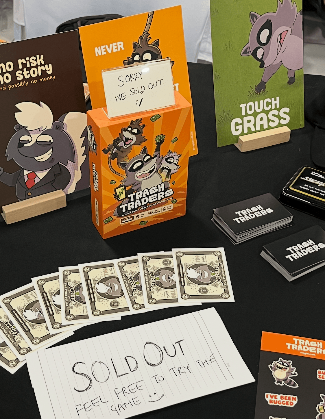 Trash Traders booth with a handwritten sold out sign
